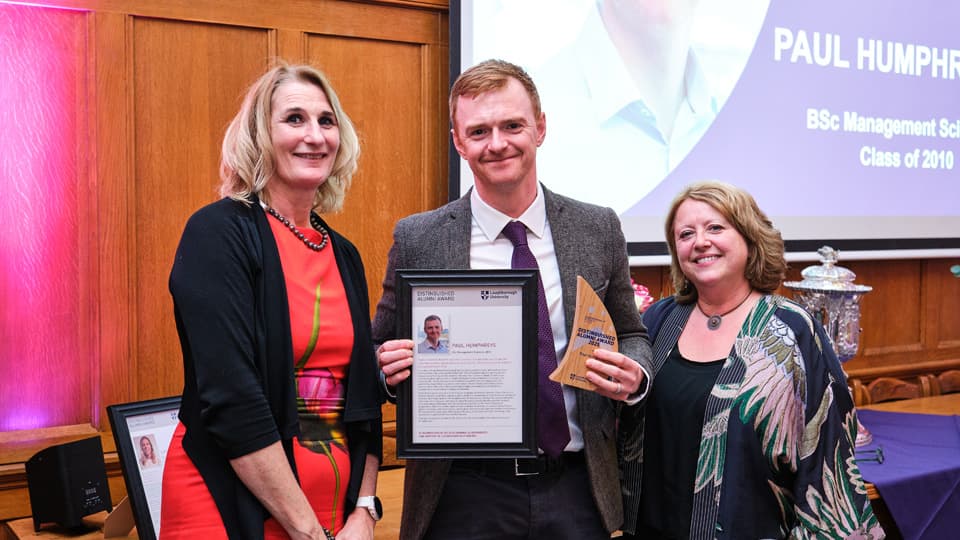 Professor Jan Godsell and Dr Cheryl Travers present a Distinguished Alumni Award to Paul Humphreys.